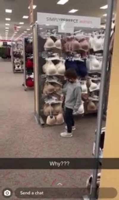 Little man enjoying his trip to target. Mom not so much.