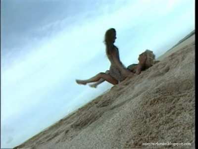 Rolling Around Playfully in the Beach
