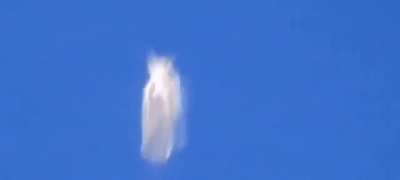 Baffled plane passenger films 'shape-shifting' UFO hovering '30,000ft' in the air.