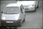 guy fakes getting hit by a car, in return gets hit by the car