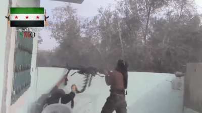 FSA fighters use the power of teamwork to target Syrian Army positions with a Dshk heavy MG - al-Shaykh Maskin - 2015