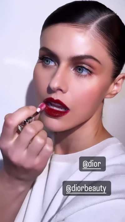 Touching up her lips IG 3/10/2024