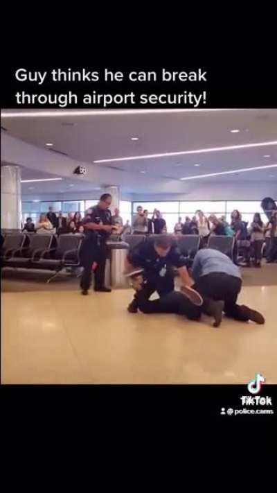 Guy trying to break through airport security