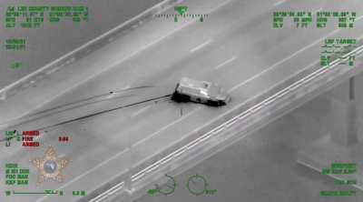 Driver Jumps off bridge in Florida after crashing car in high-speed chase.