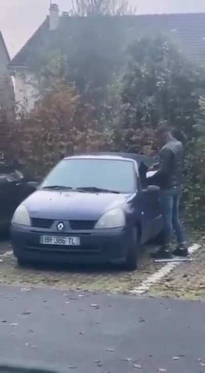 This guy trying to set a car on fire