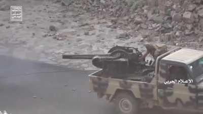 Houthi technical firing a vulcan cannon in Yemen