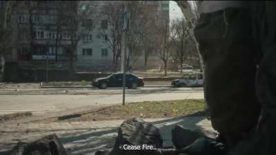 Civilian car drives into Russian crossfire during an Ukrainian ambush [Mariupol 16.03.2022]