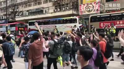 Despite huge police presence, protesters have managed to conduct a march on Nathan Road, shouting 