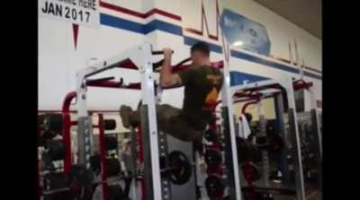 Marine on a pull up bar.