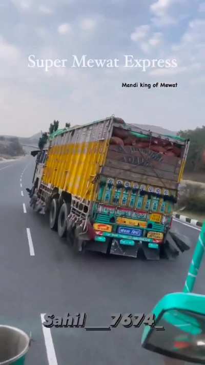 Overloaded truck in india .