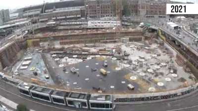 The real alternative to cars is bikes + transit. Watch how #Amsterdam builds an underwater parking facility for 6.300 bikes next to its train station. 4 years of work: well worth it!