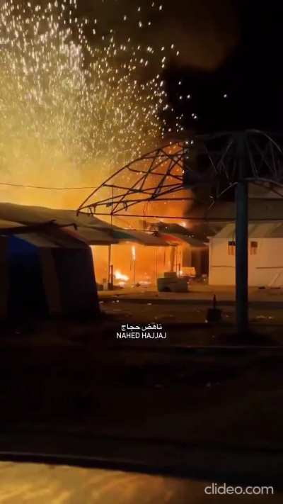 Small munitions explode in fire in Deir al-Balah, Gaza