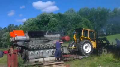 Guy tries to start an EMD 645 engine with a tractor