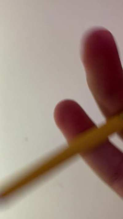 Trying to break pencil with only fingers.