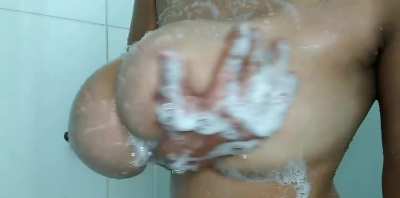 Soaping up huge Tits
