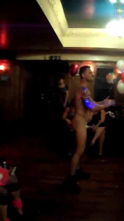 Male stripper with a big dick stripping at hen party.
