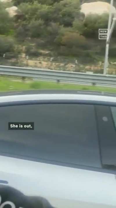 Sleeping woman in traffic using Tesla autopilot