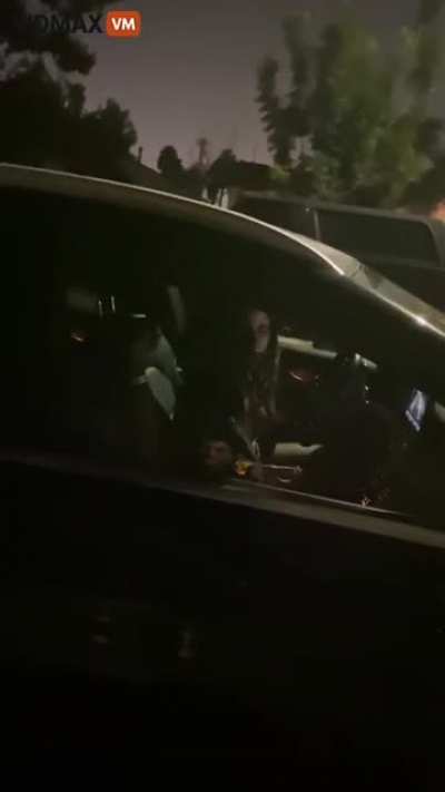 Woman dumps trash in front of guys house, gets angry, and begins to use racial slurs.