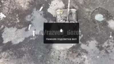 Russian drone drops grenade inside of abandoned T80 tank of the Russian Volunteer Corp