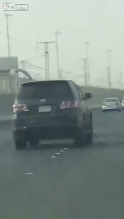 man tries to punch car on highway