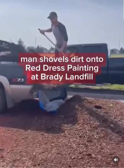 Scumbag shoveling dirt on an art mural dedicated to missing and murdered indigenous women