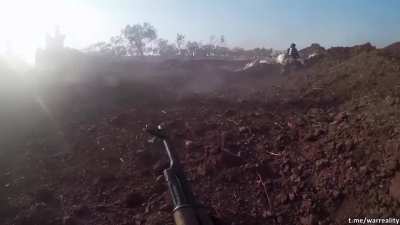 Katibat al-Tawhid wa-l-Jihad militant shot in the face during assault, Syria, village of Al-Fu'ah, Idlib Governorate