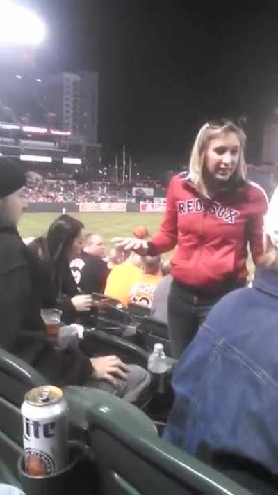 Red Sox fan spits on guy after she was called out for being in the wrong seats