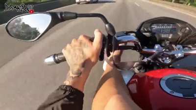 Riding motorcycle on a highway with your feet up