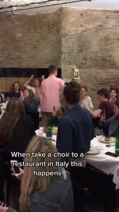 Choir finishes off their epic trip by singing a lovely South African song together in a restaurant