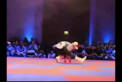 Chun Li cosplayer reenacts the character's moveset from SFxTekken during Capcom event