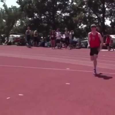 A boy high jumping