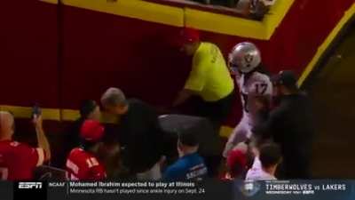 Raiders’ Davante Adams shoves cameraman after the game leaving the field.
