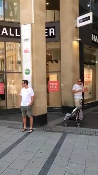 Men parked in front of stores