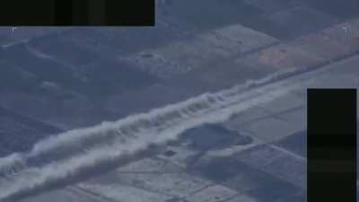 An F-16 fighter jet doing a high-speed low pass over a car as a 