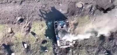 Ukrainian drone targeting russian troops hiding inside destroyed tank