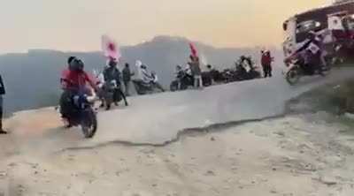Bike falls from hill, Nepal(no more context found)