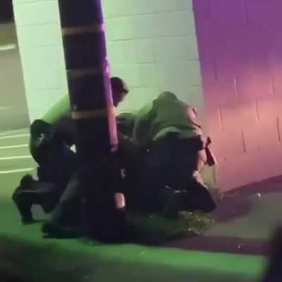 They secluded him behind a wall and looked around to see if anyone was watching so they can beat him... this is why we protest