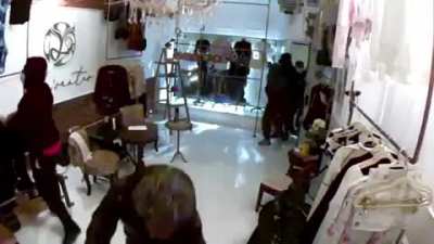 Criminals ransacking a black-owned business in Philadelphia. The owner sold her house in order to open this boutique