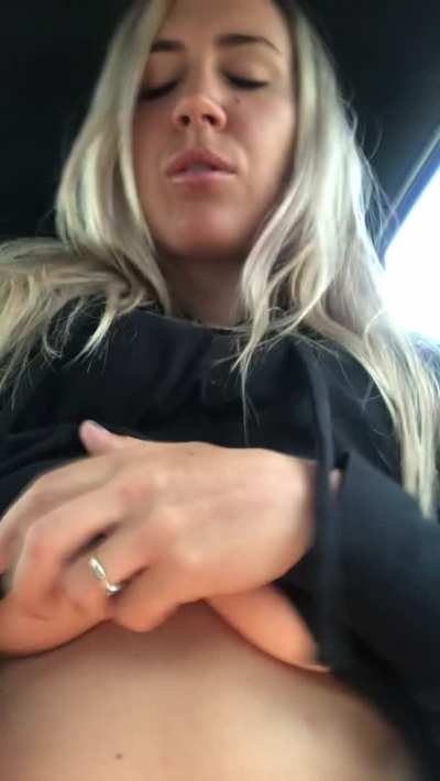 Dropping my perky tits out while sitting in my car gets me horny