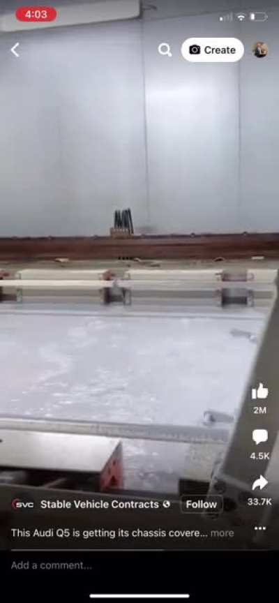 Audi Q5 getting dipped in a paint that offers rust protection and stops steel corrosion