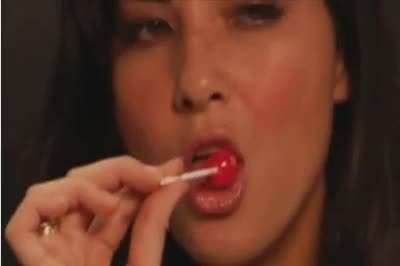 Sucking a lollipop