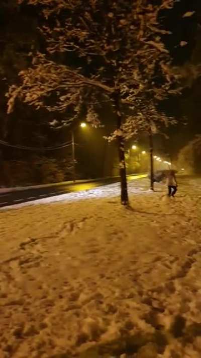 Police officers assault kids that are fighting with snowballs