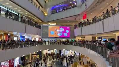 Silent white paper protest at APM mall in Kwun Tong, Hong Kong, yesterday. Police later arrested 13 people.