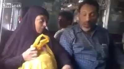 Man beating his wife in public.