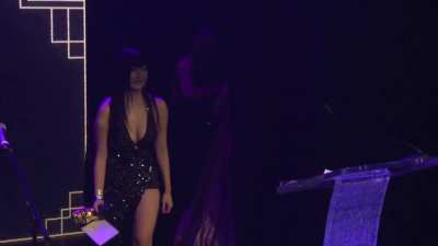Aria walking onto stage
