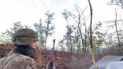 Ukrainian soldier drinking coffee while in a gunfight somewhere between Lyman and Bakhmut