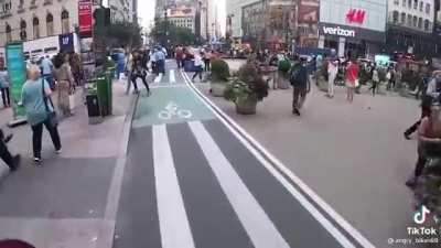 Angry biker teaches pedestrians not to use bike lane