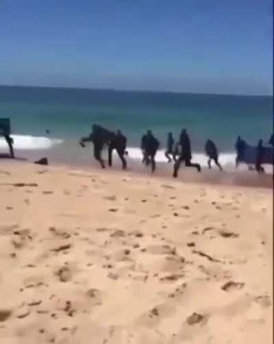 Illegal immigration from Africa in public Italian beach