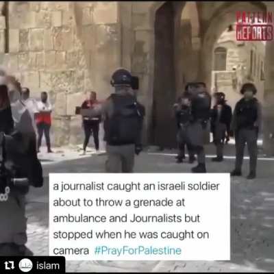 Journalist catches Israeli solider almost throwing a grenade at an ambulance and other journalists.