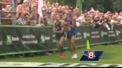 First place runner collapses 50m shy of finish line, helped across by second place runner